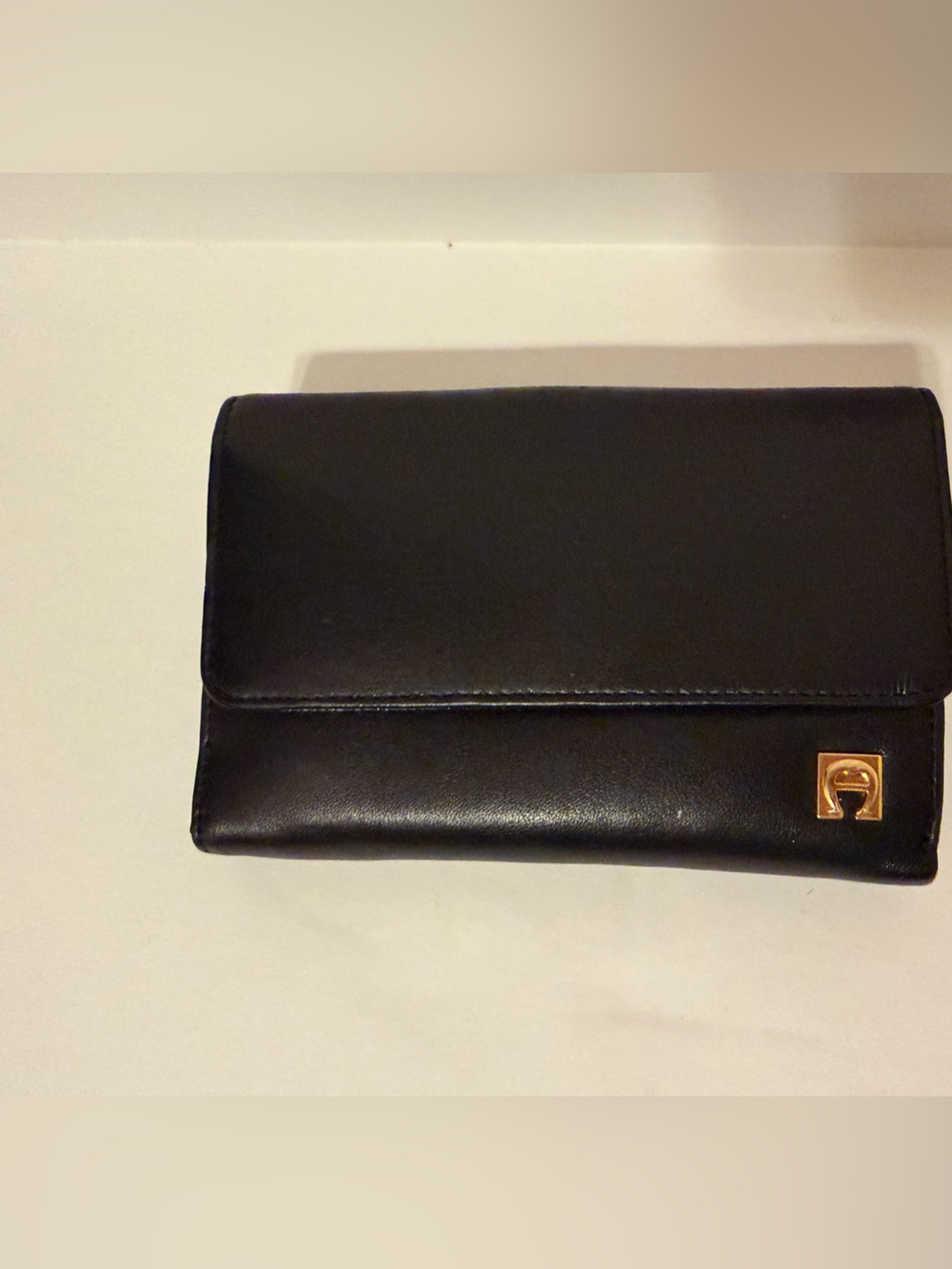 Classic Black Leather Trifold Wallet with Gold Accent